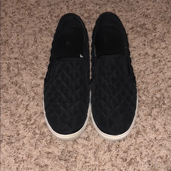 black quilted slip ons